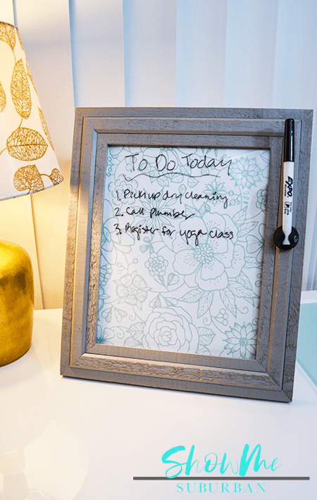 To-do list written on framed dry erase board with marker | Keep your life organized with a cute, custom dry erase board! This easy DIY project is perfect for chore lists, weekly menu, family command centers, to-do lists, reminders, and more! #organized