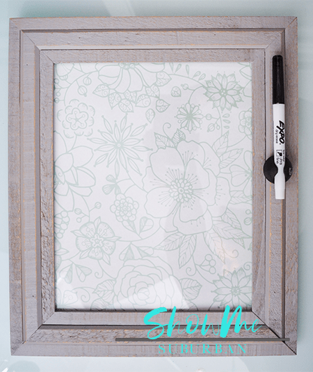 Framed dry erase board with marker | Keep your life organized with a cute, custom dry erase board! This easy DIY project is perfect for chore lists, weekly menu, family command centers, to-do lists, reminders, and more! #organized