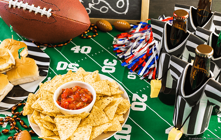 Does the thought of hosting a Super Bowl party overwhelm you? Learn how to host a stress-free Super Bowl party! Includes a quick and easy checklist, plus ideas for party favors, games, and snacks. #superbowl #party #stressless