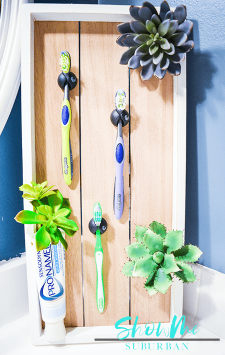 Cable clip organizer toothbrush holder | Cable clip organizers can do more than hold your phone cord in place! This honest review of Blue Key World's cable clip organizers includes simple and unique DIY projects for a toothbrush holder, jewelry organizer, and custom dry erase board! #organized #organizing